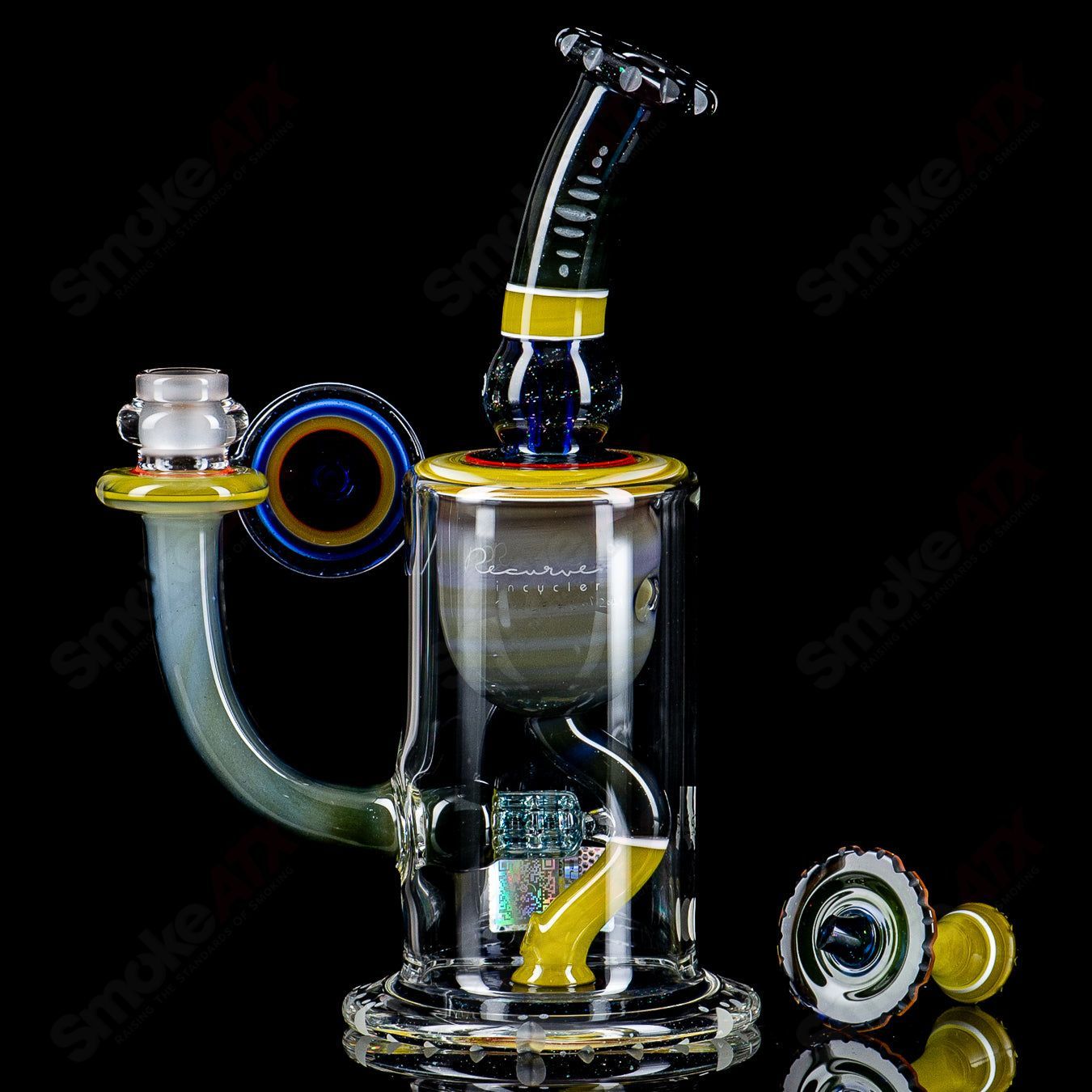 Mobius Recurve Circle Solo #6 of 2024 Heady Glass Bubbler with intricate glasswork and clear accents.