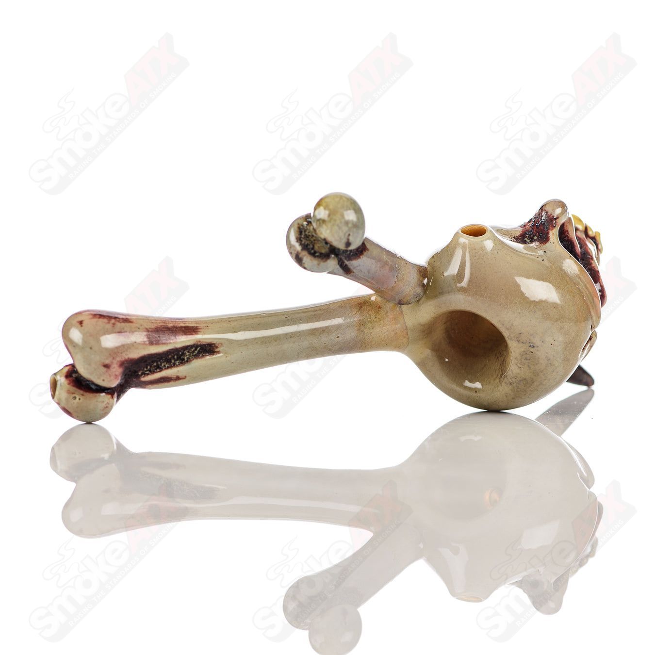 Ghost Glass skull spoon heady glass hand pipe featuring a detailed skull design for smoking or display.