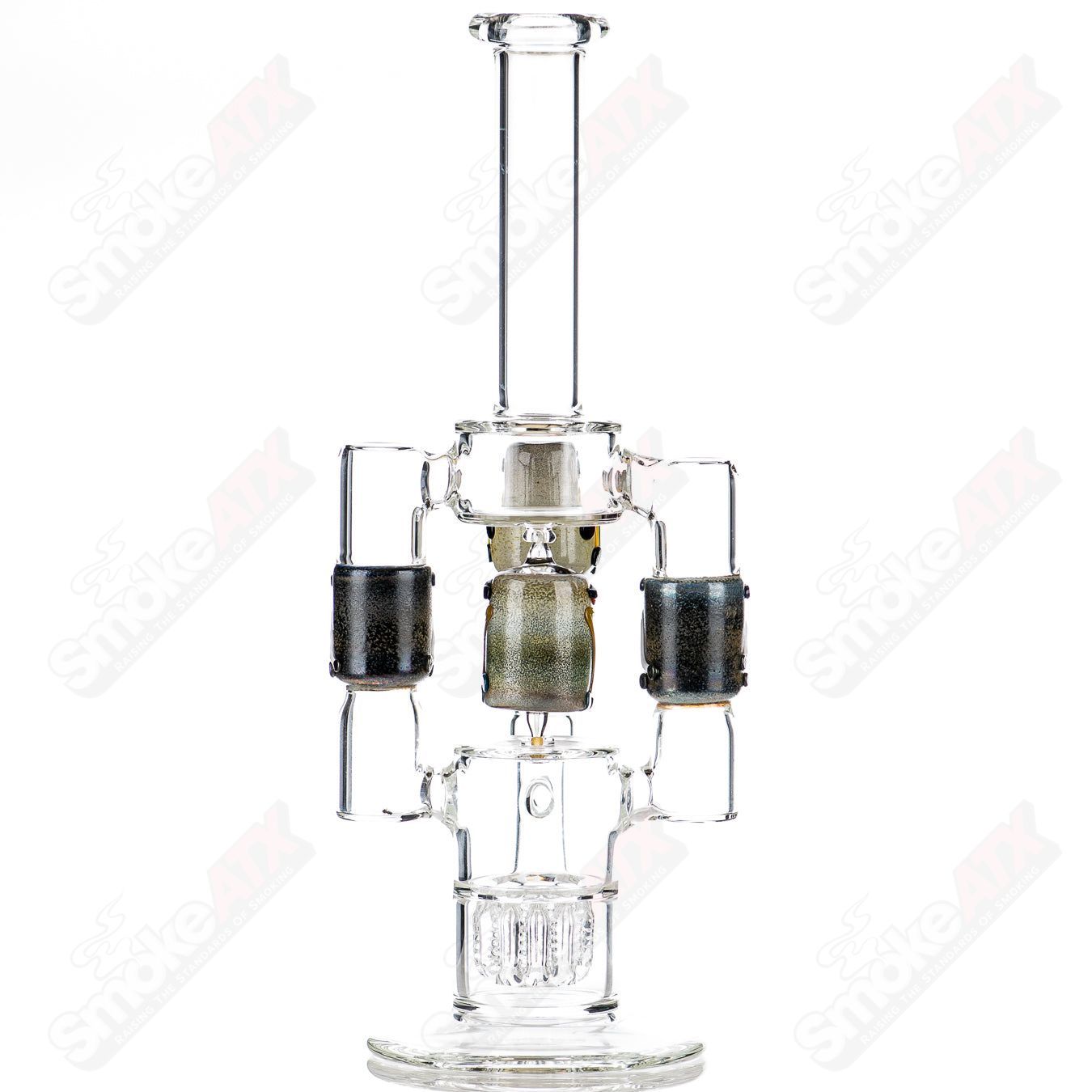 Spinning Tiki Head scientific glass tube by Carsten Carlile and Dirty Rico, featuring detailed tiki head design and scientific tubing.