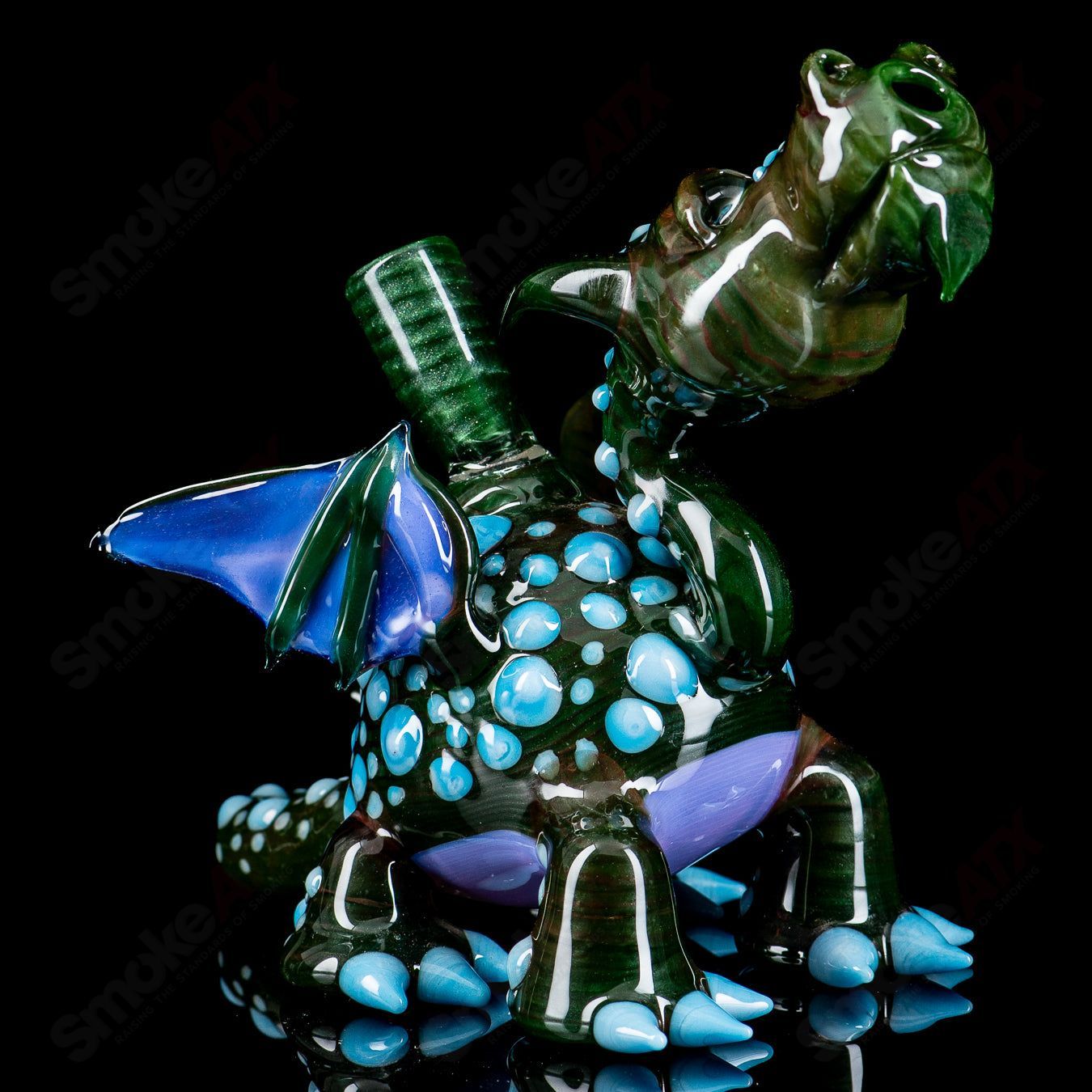 Spotted Dragon rig by Hendy Glass, a colorful heady concentrate rig featuring a detailed dragon design and vibrant spotted pattern.