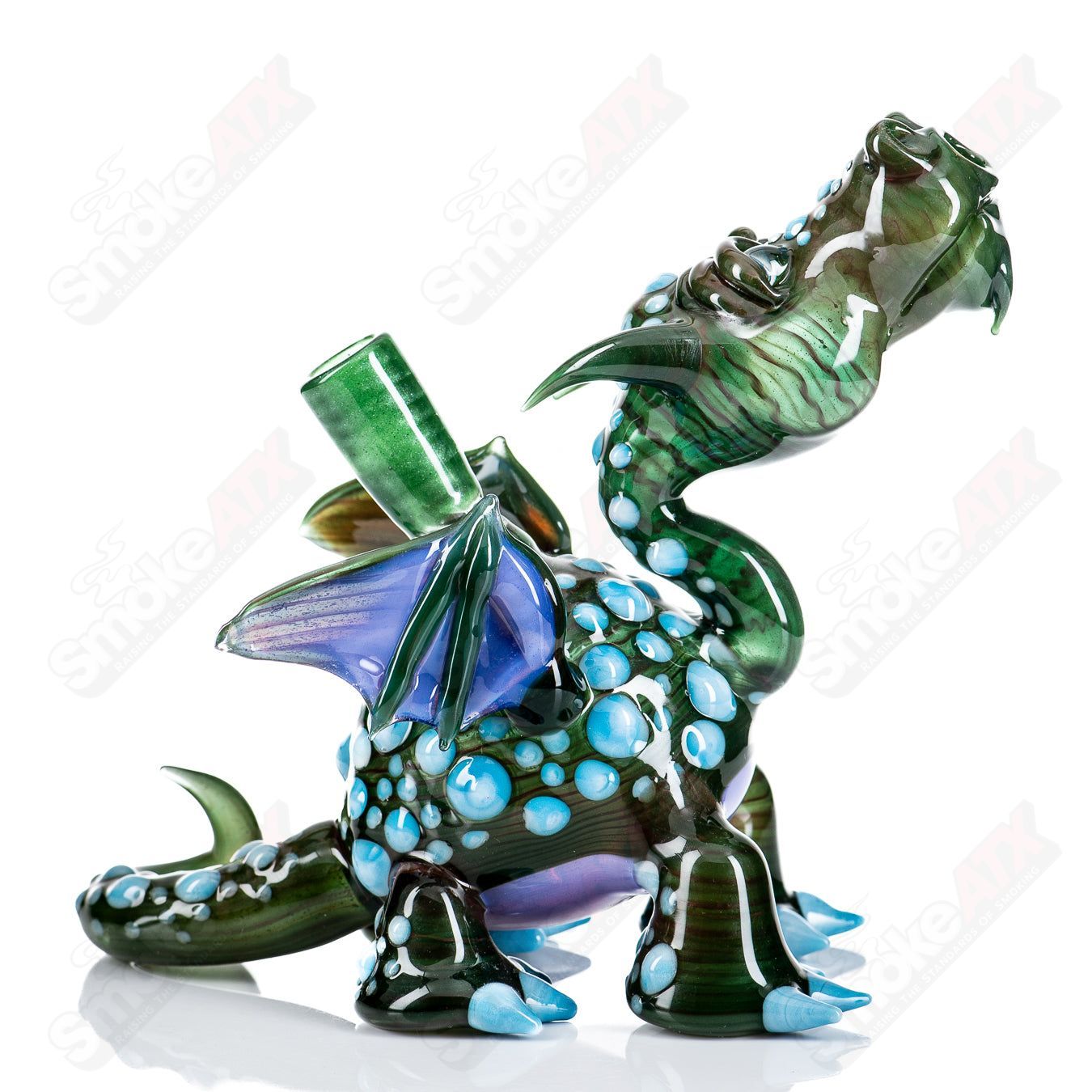 Spotted Dragon rig by Hendy Glass, a colorful heady concentrate rig with intricate spotted dragon design and clear glass accents.