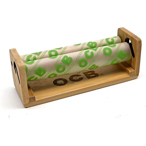OCB 1.25-inch bamboo rolling machine for rolling papers, showcasing the compact, eco-friendly design and bamboo material.