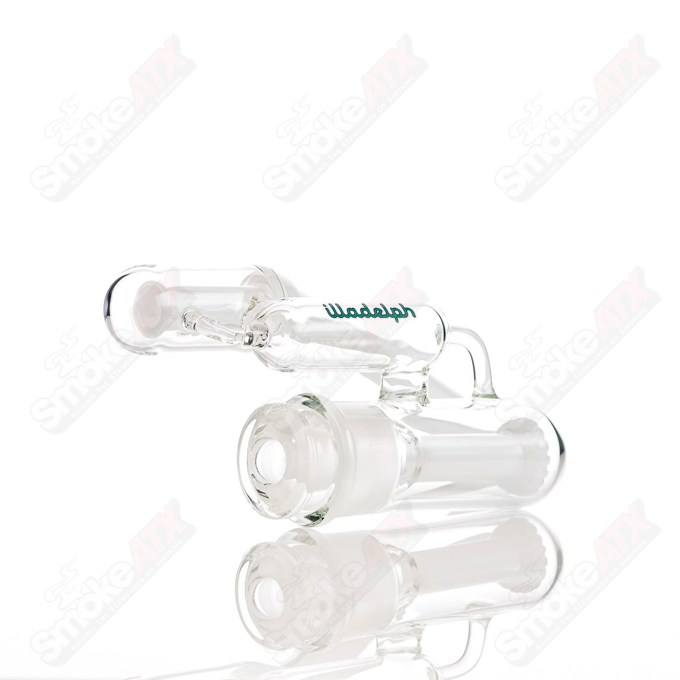 Teal glass disc ash catcher by Illadelph, designed for smoking pipes, featuring a round disc shape and clear glass details.