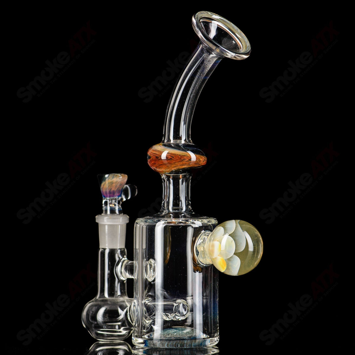 Glass waterpipe called Marble Implosion Daft ATX, featuring a natural marble design and clear glass construction.