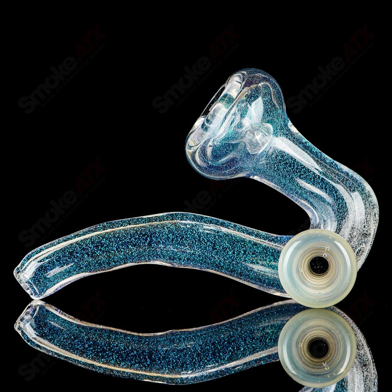 Transparent Dichro Sherlock glass by JMK Glass featuring colorful, shimmering dichroic effects and signature detailing.