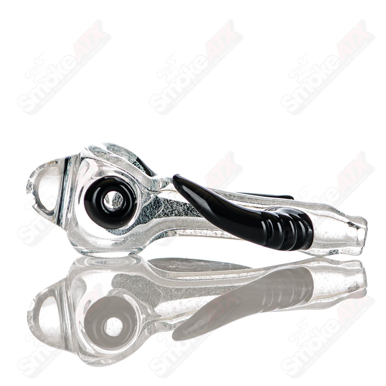 Transparent dichro spoon hand pipe with black horn accents, signed by JMK Glass, crafted for artistic and functional use.