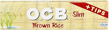 OCB King Slim brown rice rolling papers with included tips, designed for smooth rolling and a clean smoking experience.