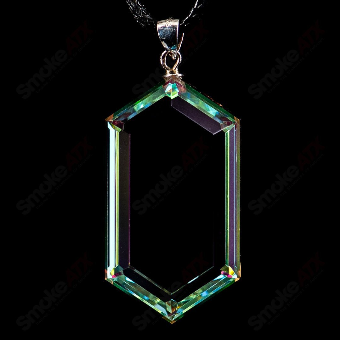Faceted glass pendant by Fatal Facets, a stylish heady glass jewelry piece with intricate faceted design and vibrant colors.