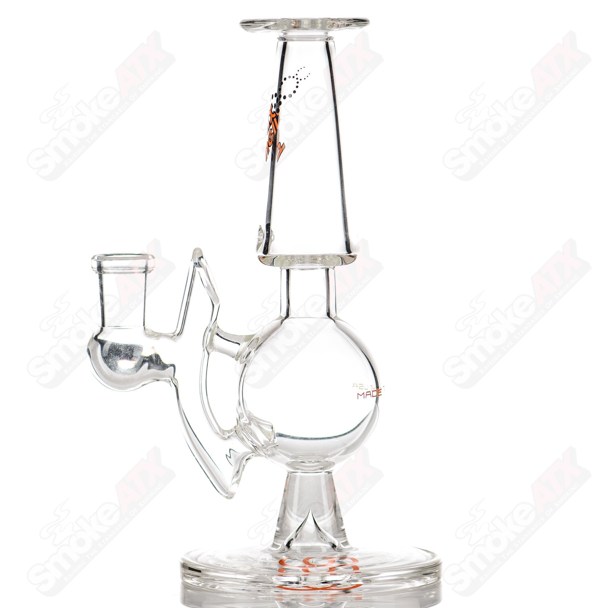 Orange Label Titan Series Helios Helix glass concentrate rig by American Helix with a sleek, clear design and intricate helix detailing.