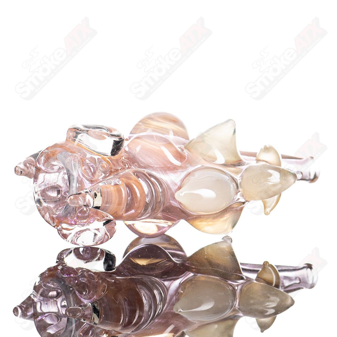 Shapely fumed Chillum pipe made by JMK Glass, featuring a smooth glass design with colorful fumed accents.