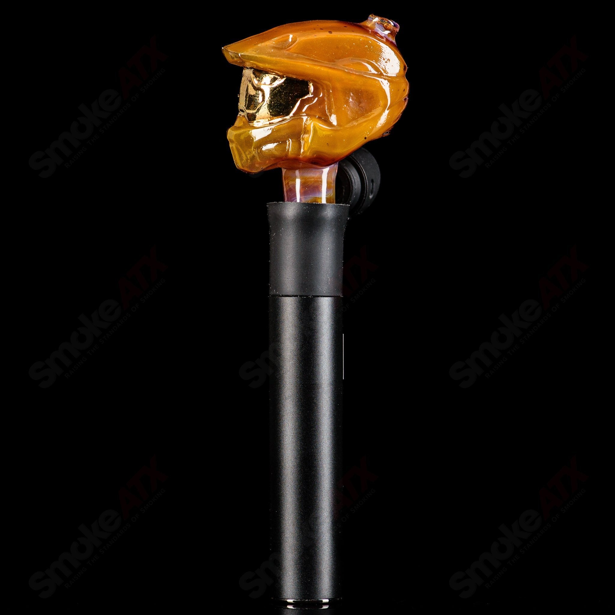 Glass Puffco tops Halo Pivot Mouthpiece by Tony Kazy, featuring clear glass design and ergonomic shape.