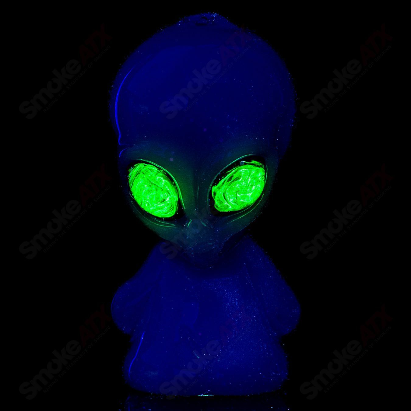 White alien hand pipe with UV crushed opal eyes, crafted by Ghost Glass, featuring a detailed heady glass design.