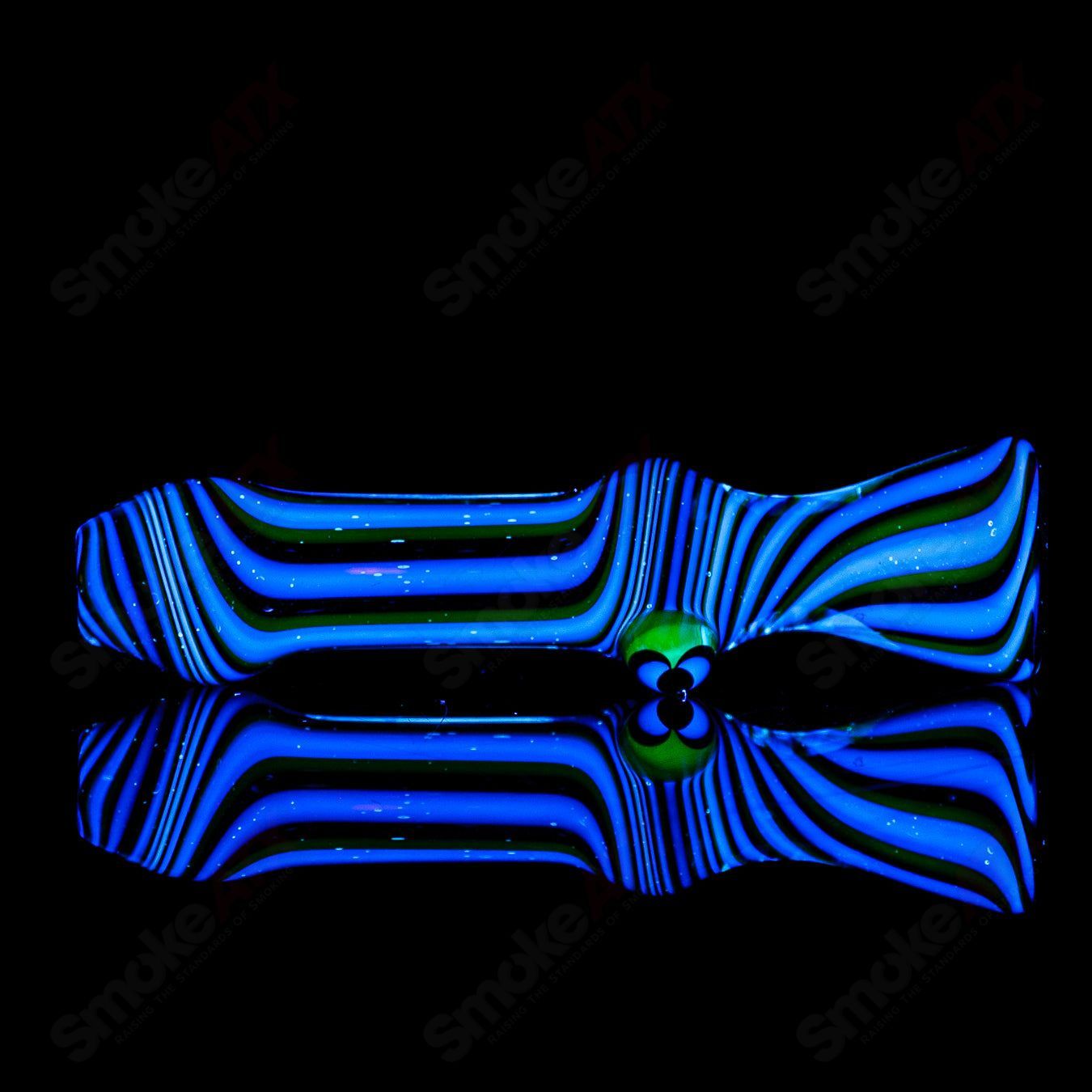 Worked UV Galaxy Chillum by Indo Glass, a glass chillum with vibrant galaxy and UV-reactive design, perfect for smoking sessions.