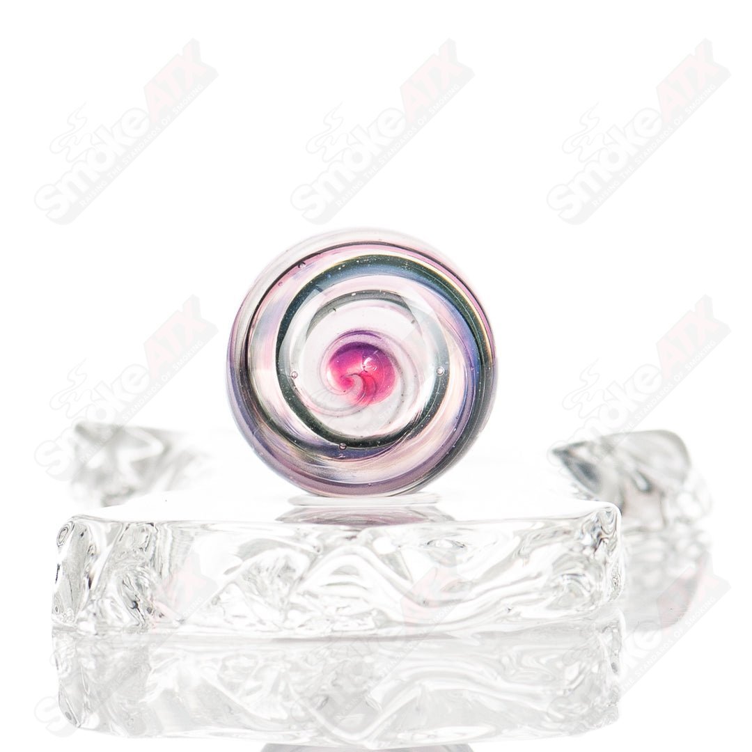 Colorful UV Spiral Mib Indo Glass marble with vibrant swirl patterns, crafted by Indo Glass, designed for collectible marble enthusiasts.