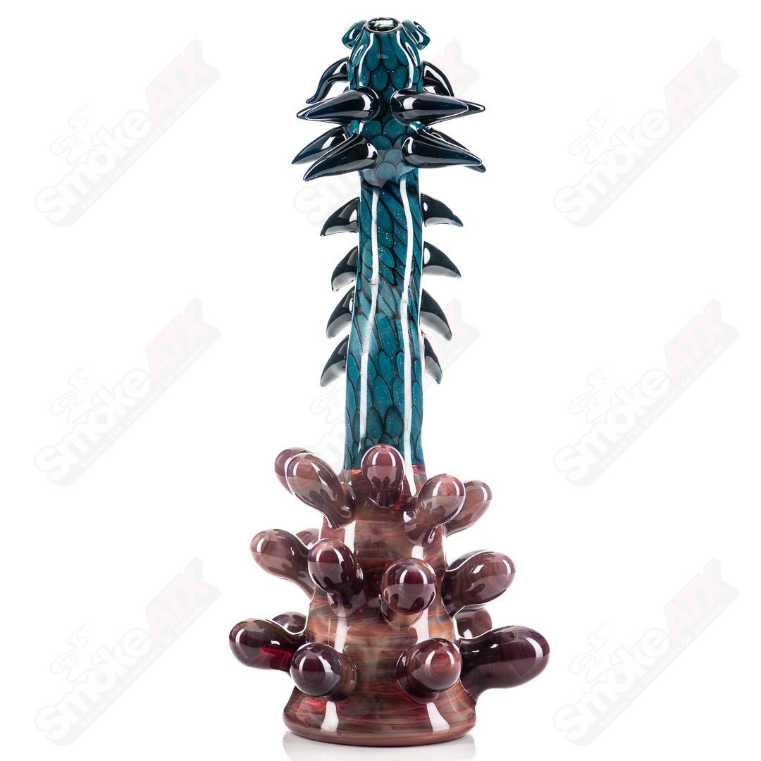 Glass Spiked Dragon Rig by Focused Fire, a concentrate rig with a detailed dragon design and spiked features for dabbing.