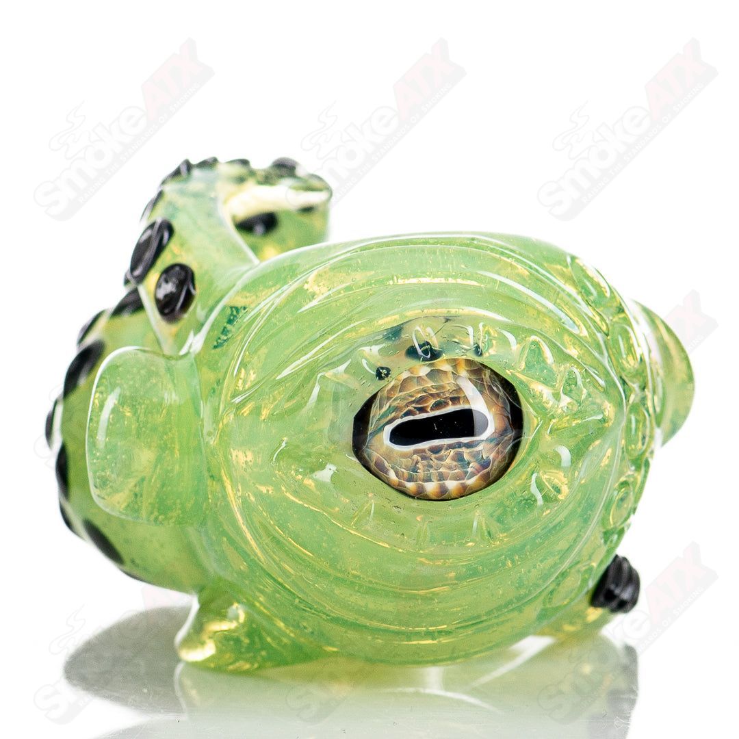 Colorful Seamonster Spoon hand pipe by Mako Glass, featuring intricate glasswork and playful sea creature design.