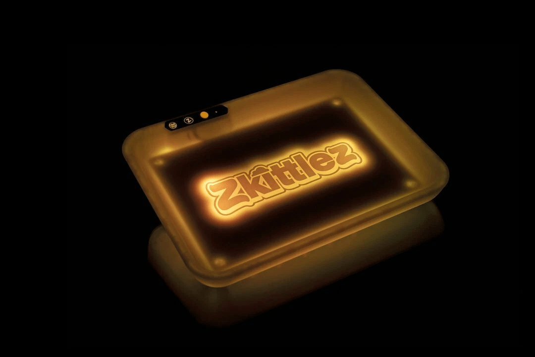Yellow Zkittles Glow Tray for rolling and storage, featuring vibrant yellow design with glow-in-the-dark elements.