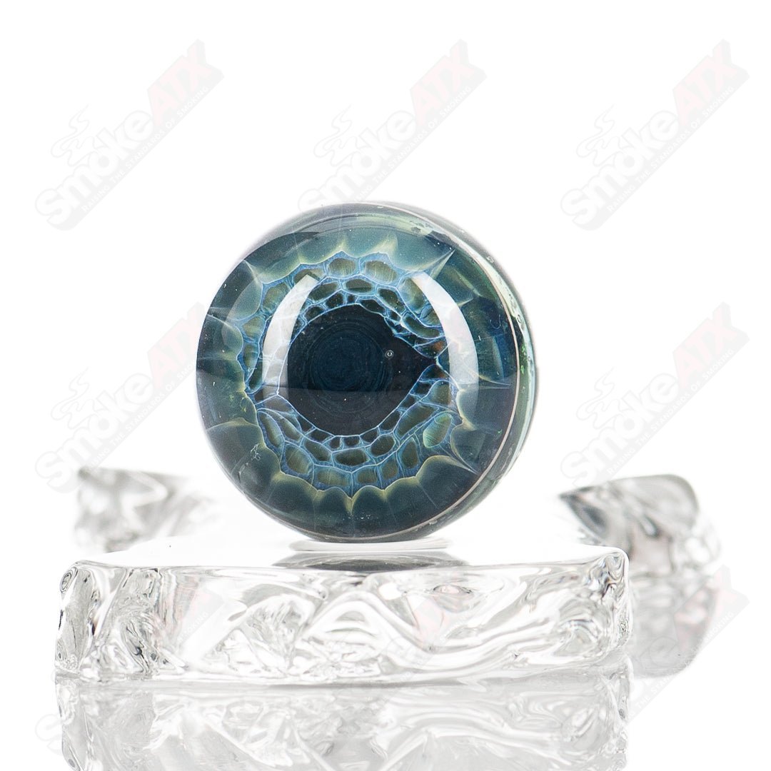 Colorful Cropal Wag Eye Mib Indo Glass heady glass with intricate marble designs, showcasing artistic glass craftsmanship.