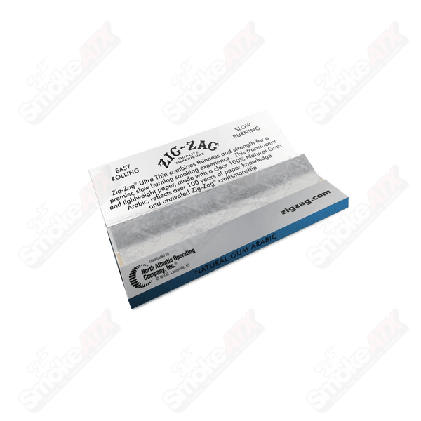 Ultra thin Zig Zag rolling papers, 1 1/4 size, for rolling cigarettes or herbal blends, lightweight and easy to use.