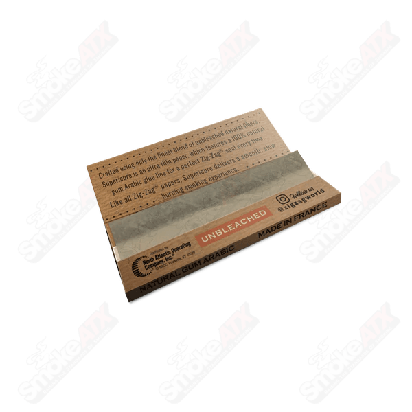 Unbleached Zig Zag 1 1/4 rolling papers from Zig Zag, showcasing natural, eco-friendly rolling paper sheets.