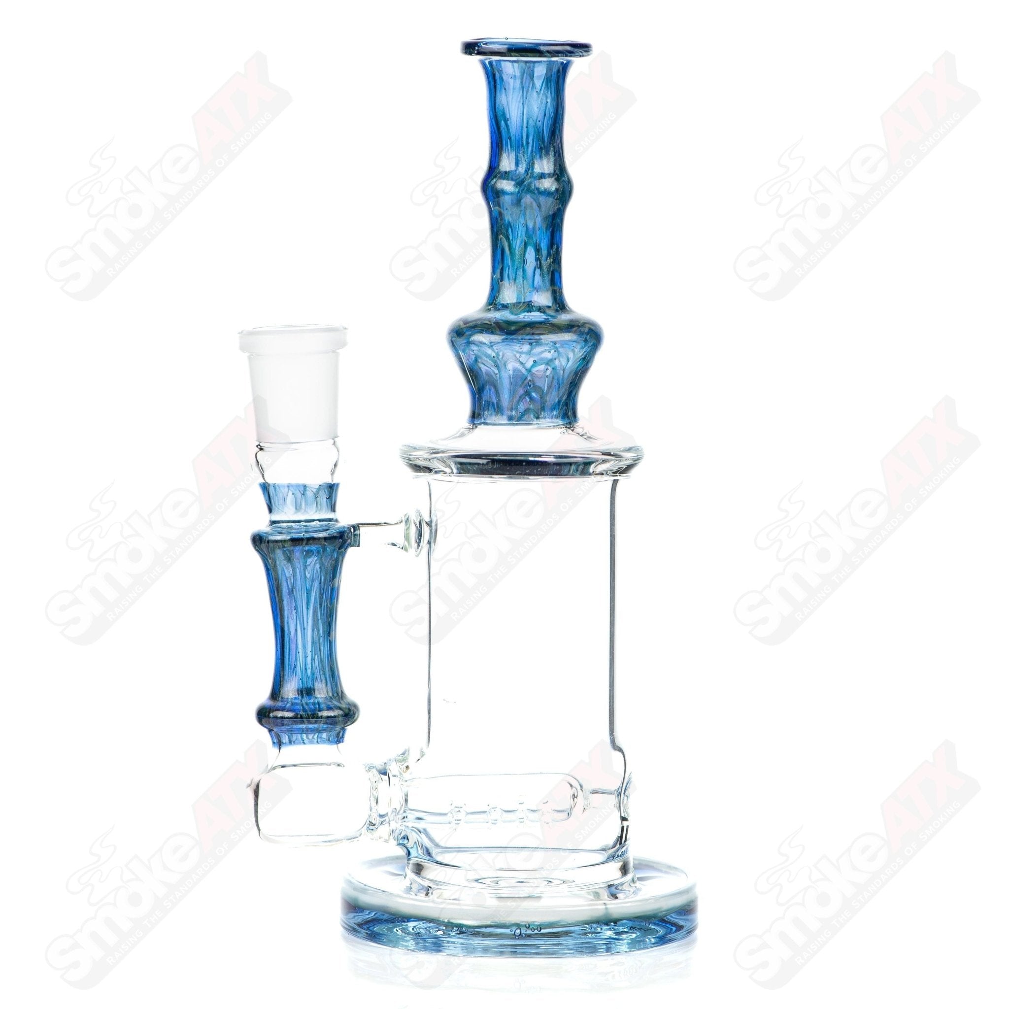 Tagle Glass inline tube bubbler with 18mm and 50mm wrap and rake design, clear glass construction for smoking enjoyment.