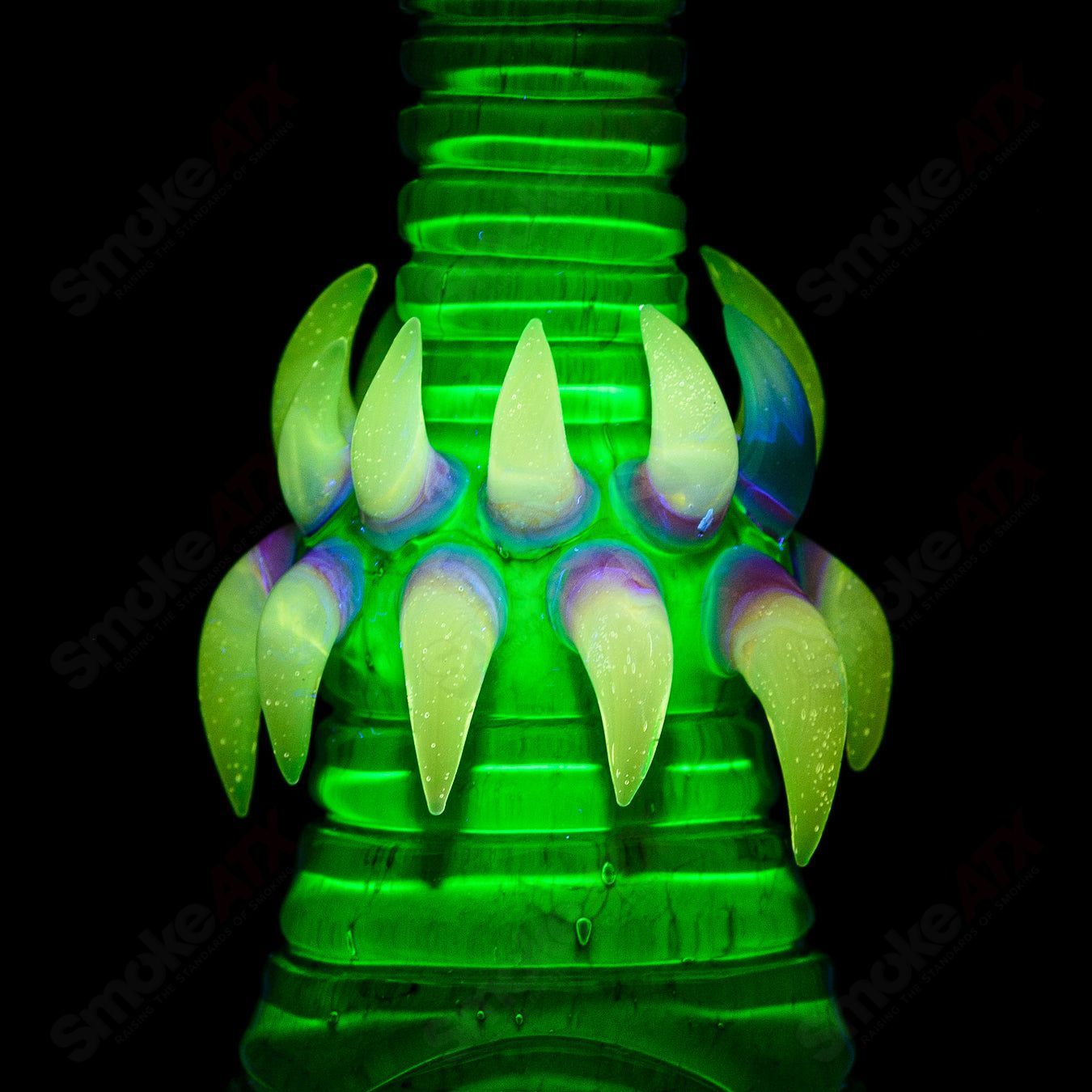 UV double barrelled Rip Curl heady glass concentrate rig by Salt Glass with vibrant UV-reactive design and intricate glasswork.