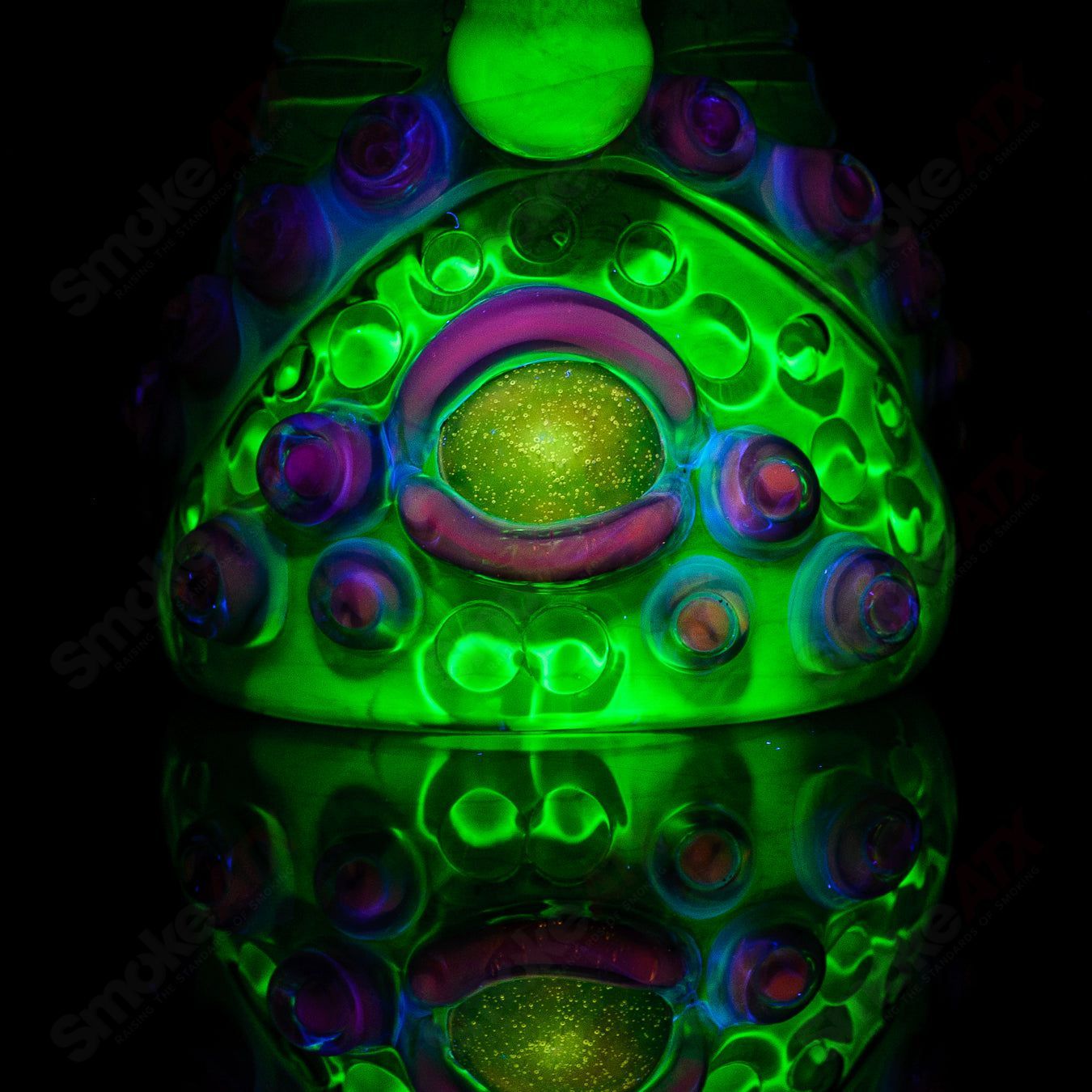 UV double barrelled Rip Curl concentrate rig by Salt Glass, made of heady glass with vibrant UV-reactive details.