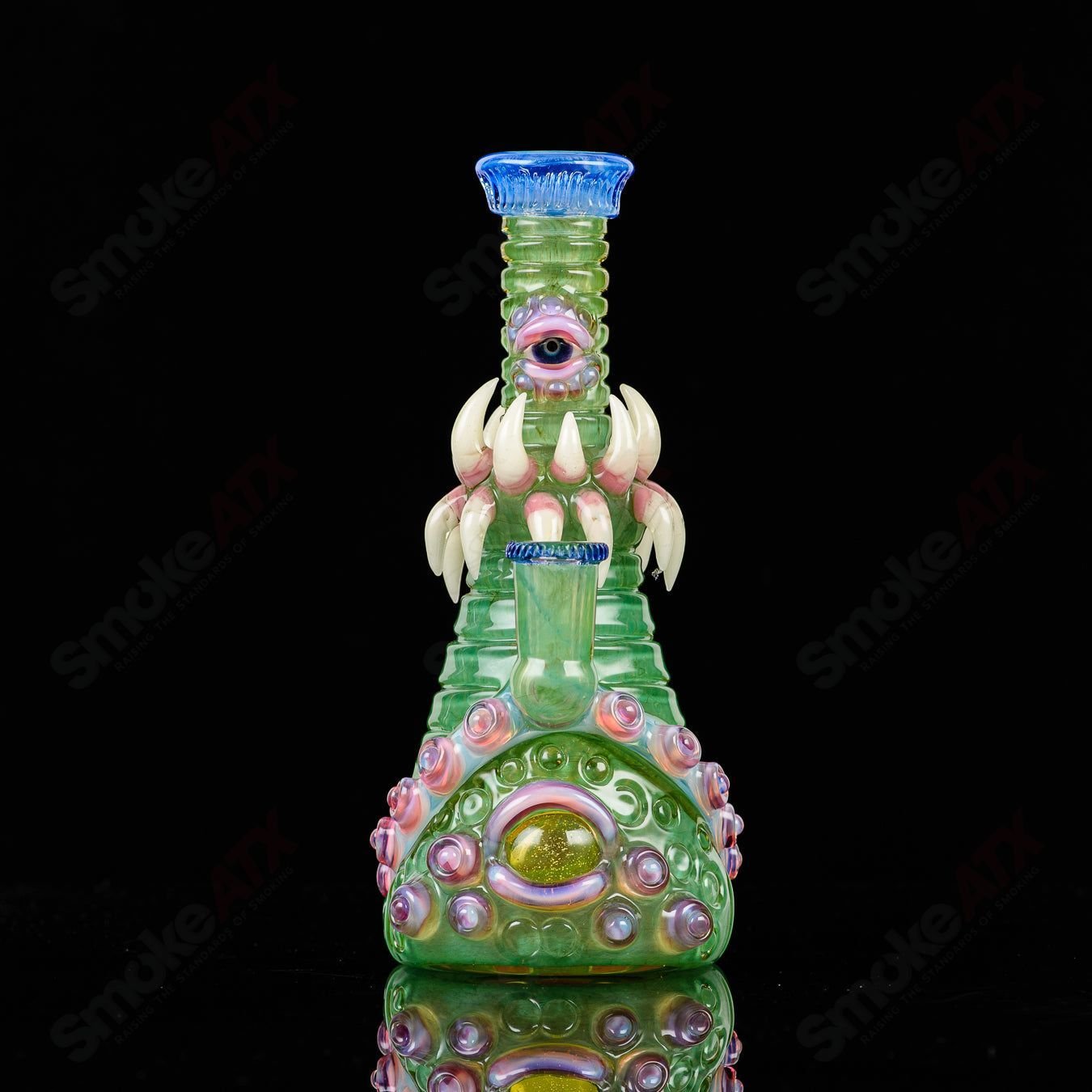 UV double barrelled Rip Curl concentrate rig by Salt Glass, featuring vibrant colors and intricate heady glass design.