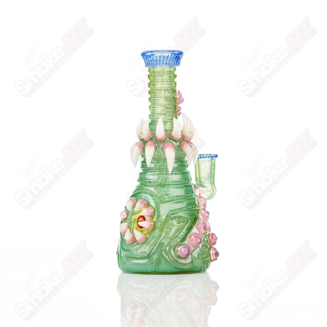 UV double barrelled Rip Curl concentrate rig by Salt Glass, featuring colorful glass design and intricate heady glass craftsmanship.