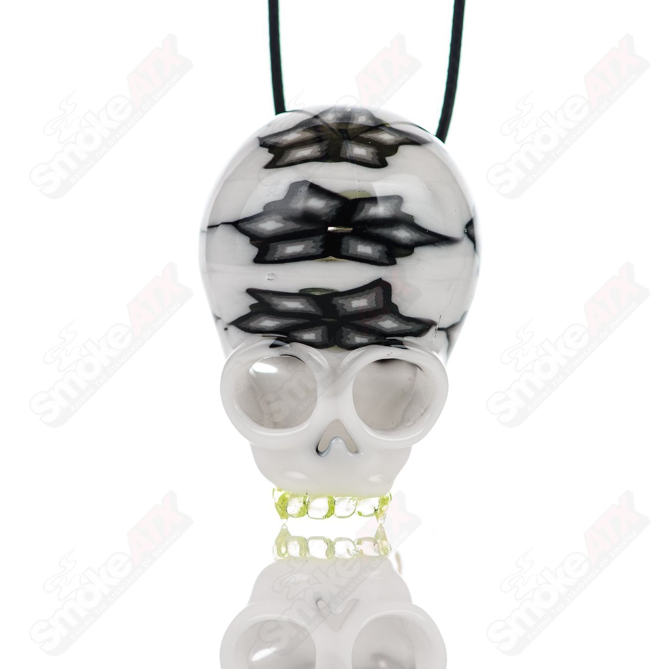 Cap’n Crunk UV Milli Skull Pendant made of heady glass, featuring a vibrant skull design with ultraviolet reactive elements.