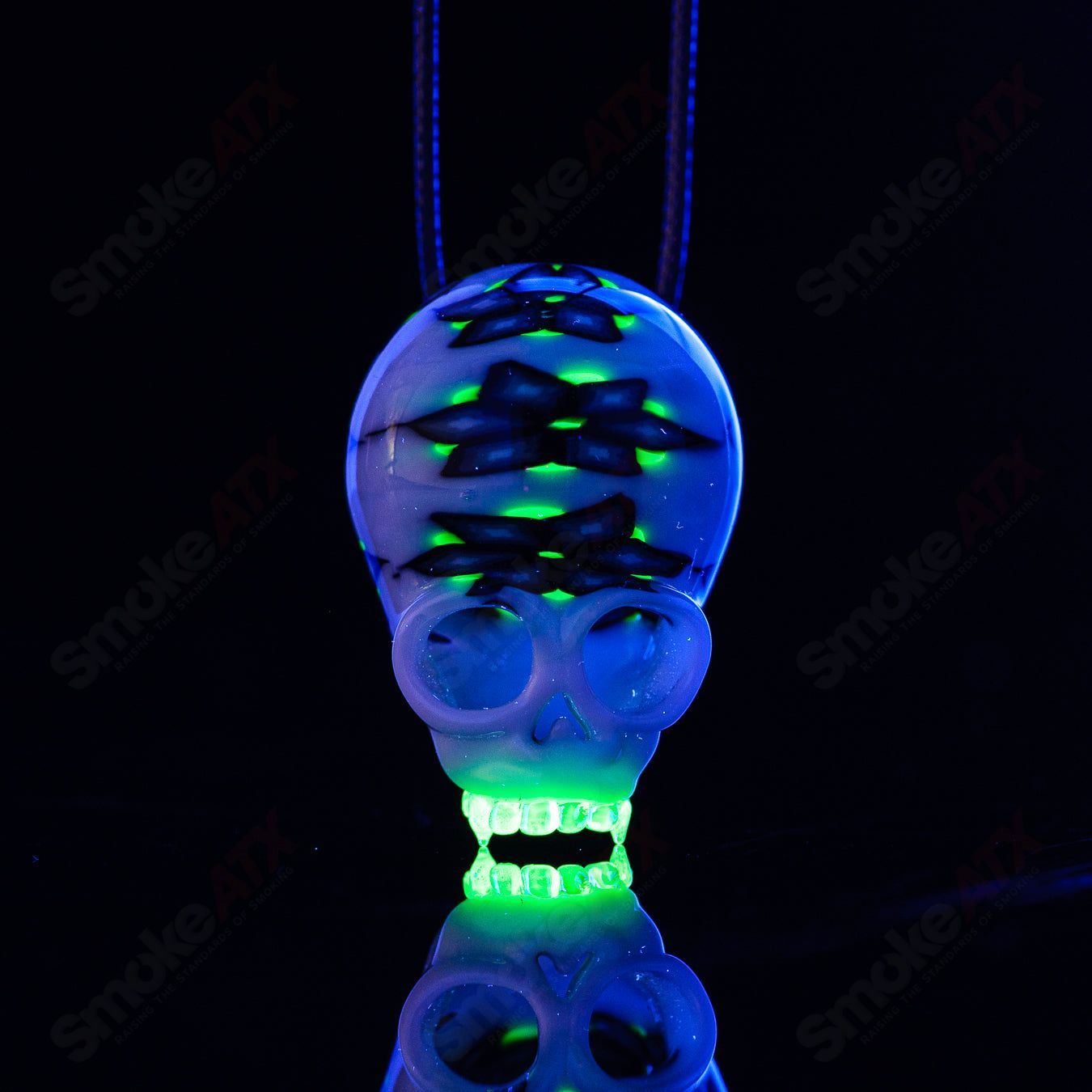Cap’n Crunk UV Milli Skull Pendant, heady glass jewelry with vibrant glow-in-the-dark features and detailed skull design.