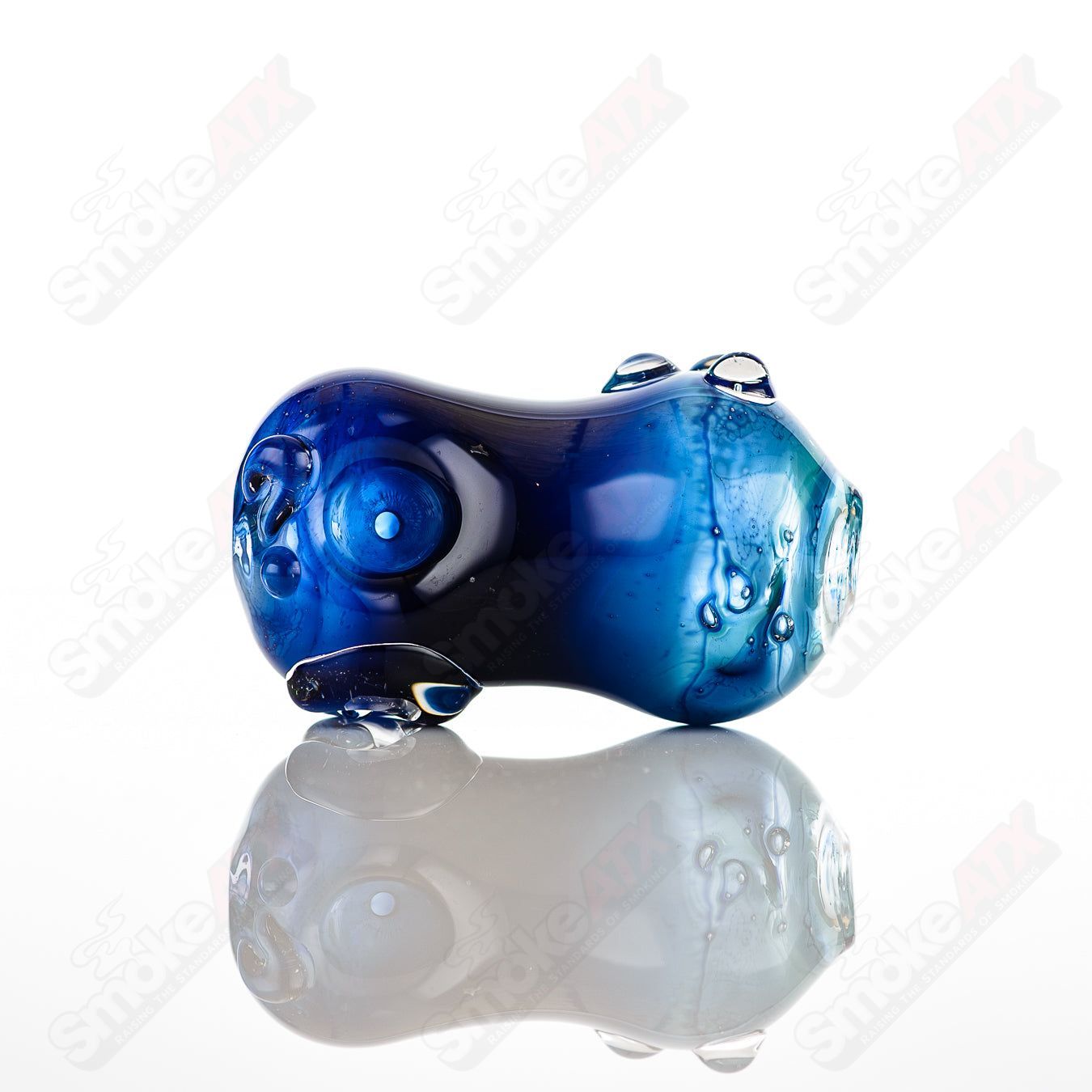 Glass pipe called the #10 Bean Spoon by Nobody, featuring a clear glass design and a rounded spoon bowl for smoking.