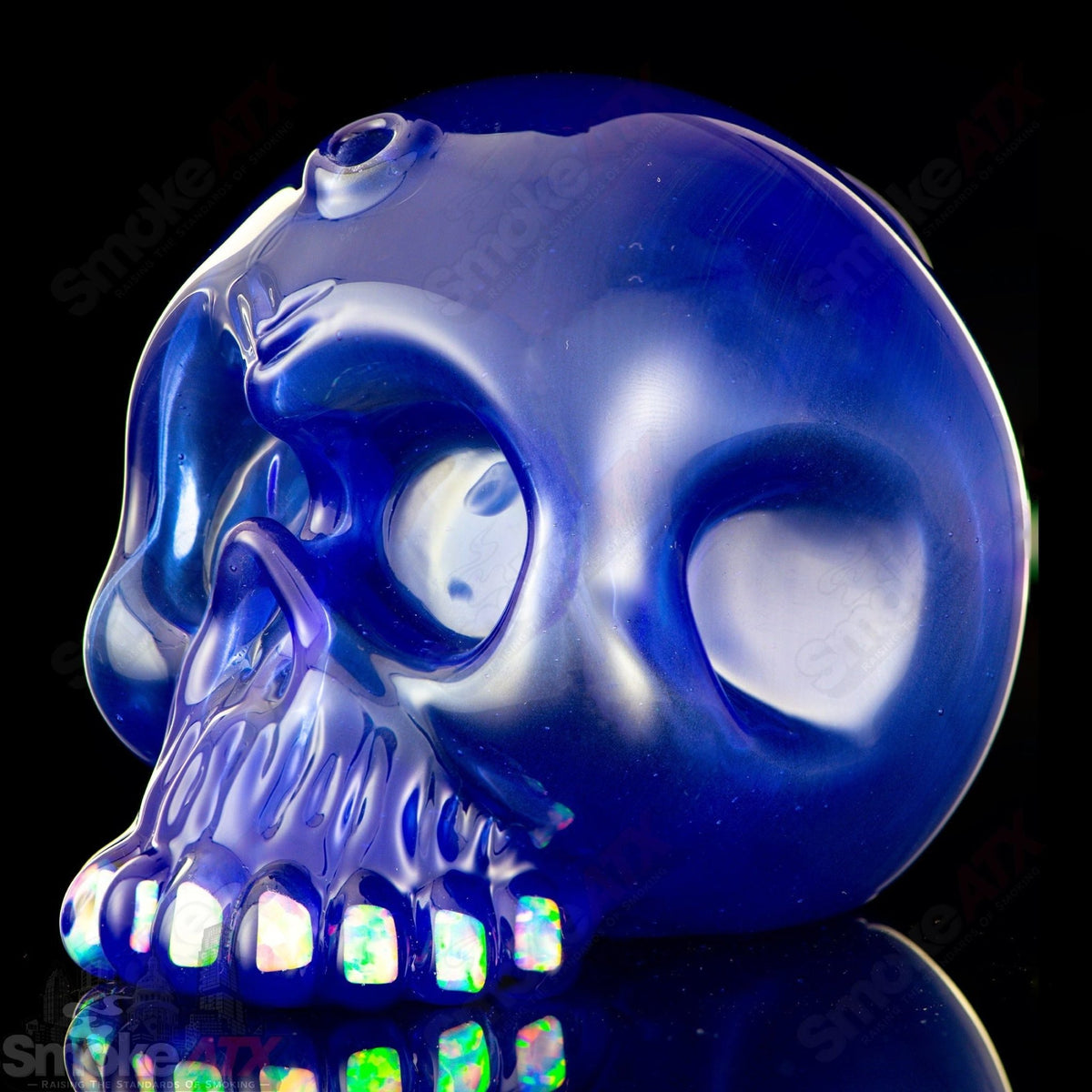 10mm Brilliant Blue Skull Shredder concentrate rig by Carsten Carlile, featuring vibrant blue glass and detailed skull design