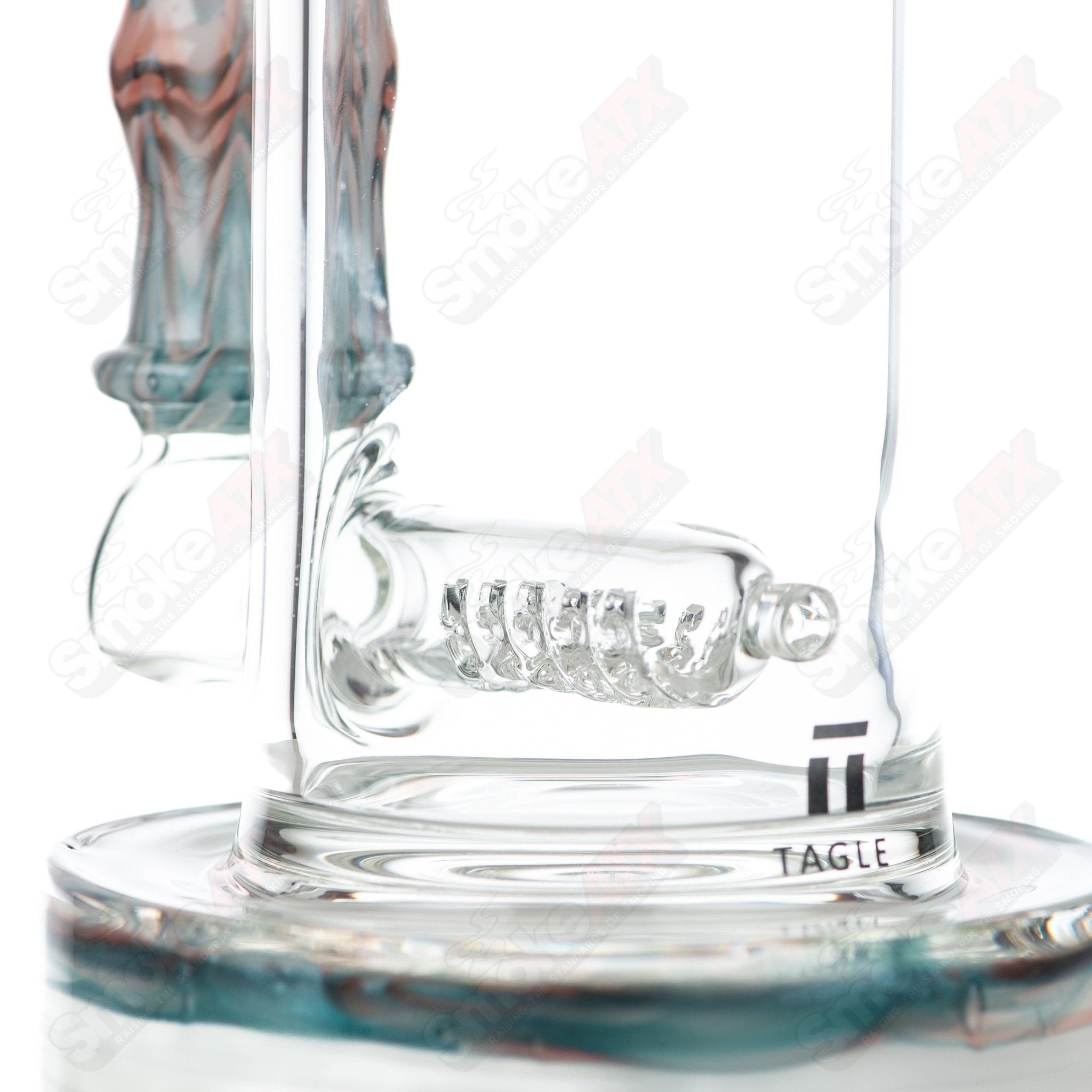 Tagle Glass 18mm 60mm Wrap n Rake Inline Tube Waterpipe made of clear glass with intricate design details