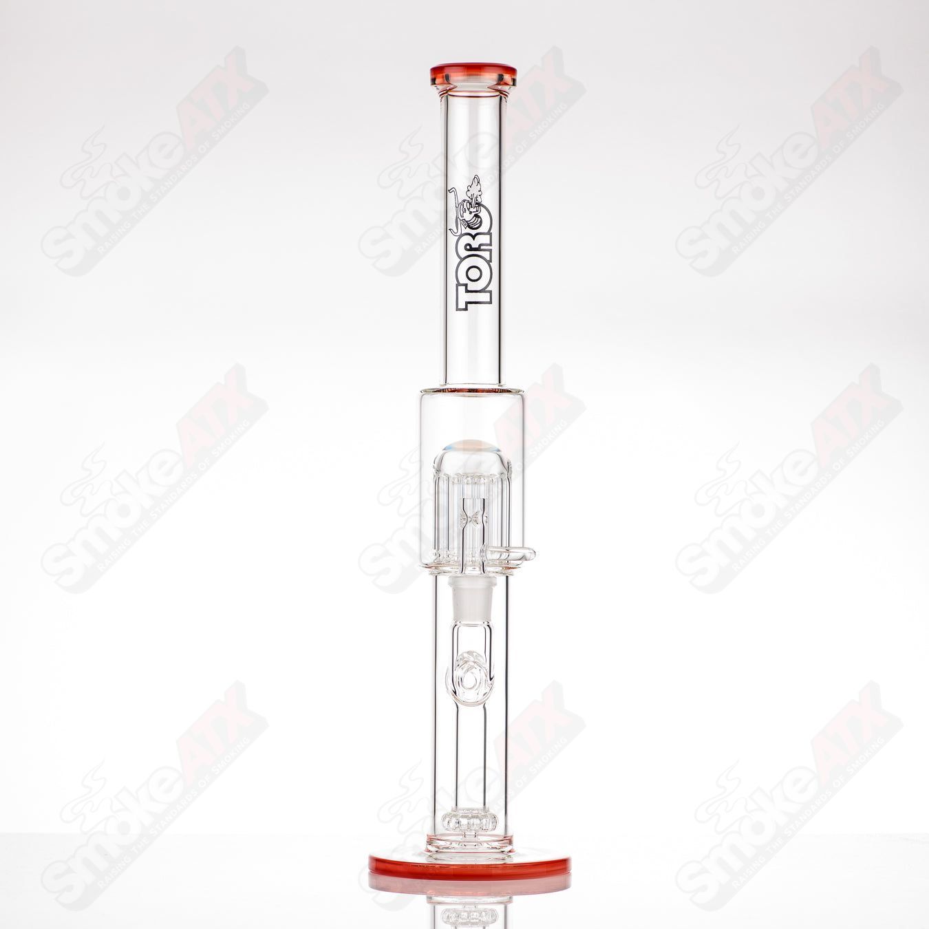 Toro glass straight tube with 18mm circular joint, 13-arm perc, colorful foot and mouthpiece accents, clear and vibrant design.