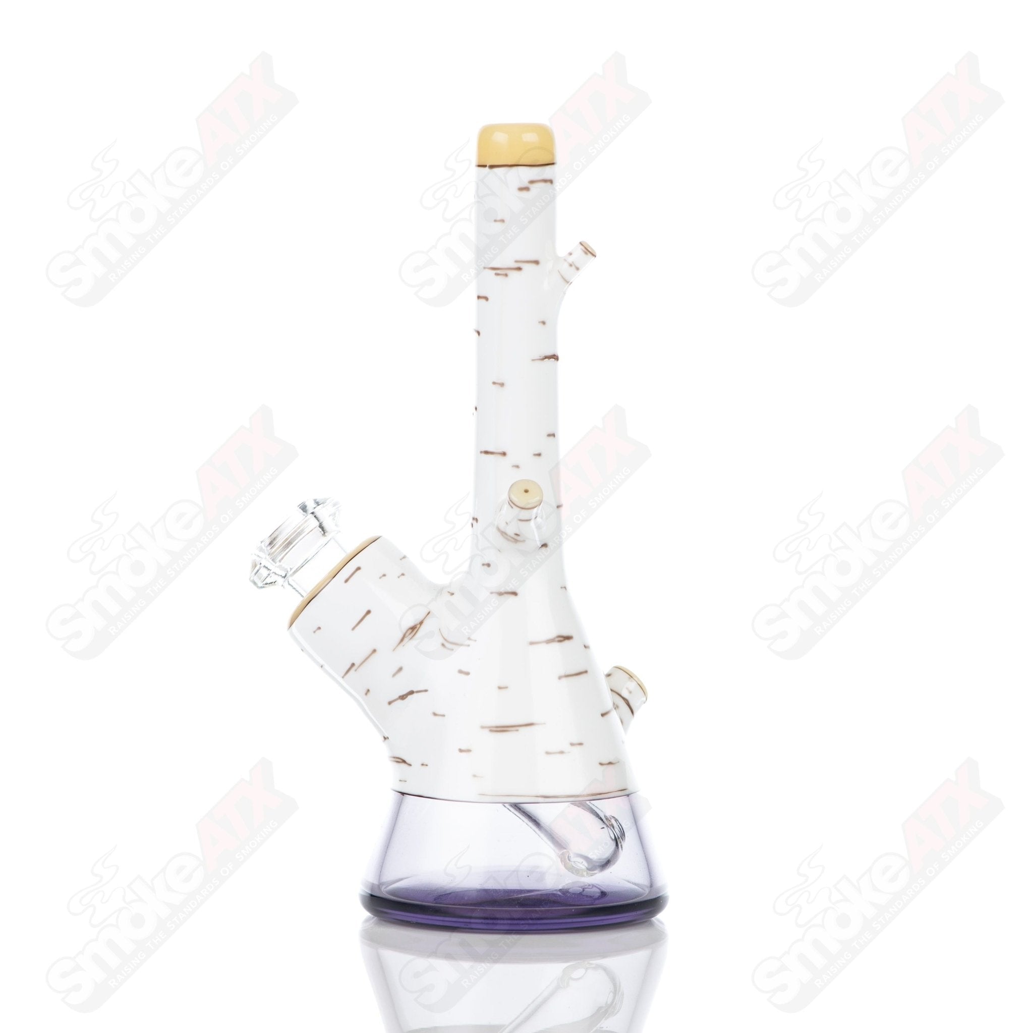 Foster Glass Heady Glass Birch Mini Tube in clear foster glass with a sleek, compact design and birch pattern details.