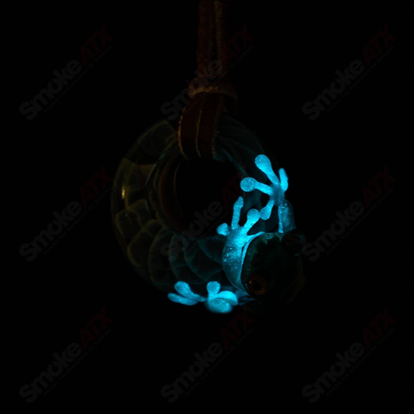 Kengtaro Hide and Seek Frog pendant made of colorful glass, featuring a playful frog design, suitable as a stylish jewelry piece.