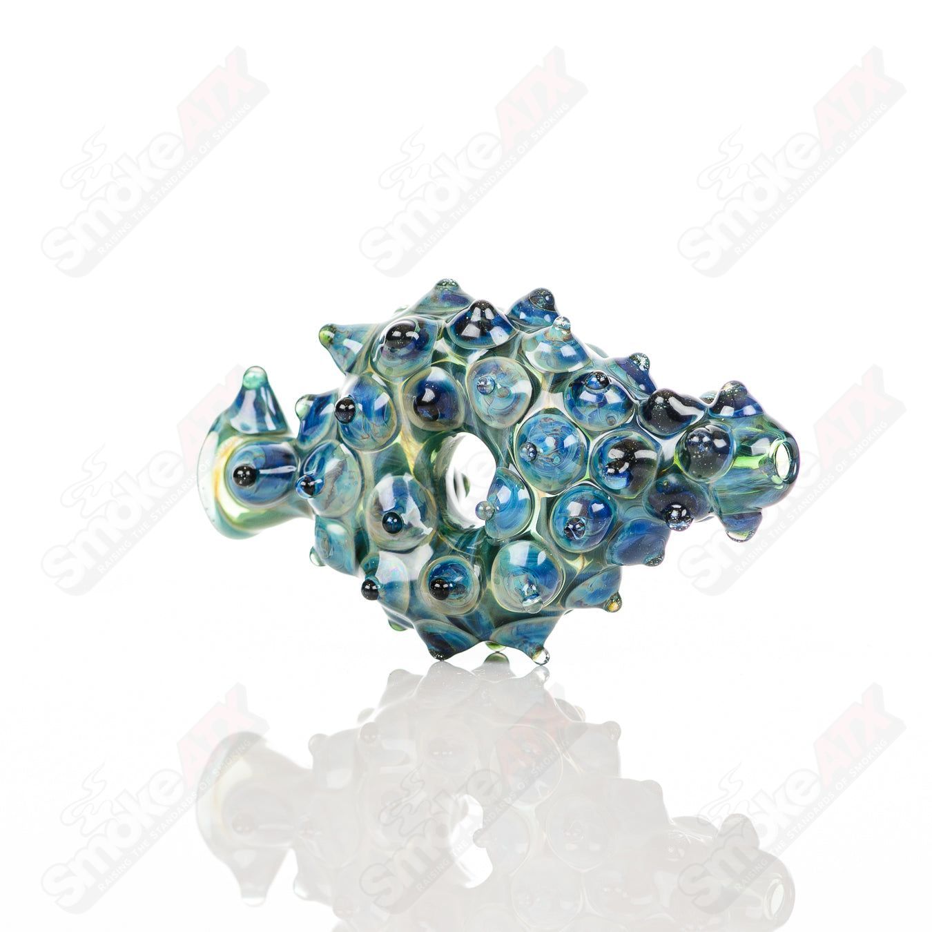 Large glass donut chillum by Baby Dabs, designed for baby dabs, with a colorful donut pattern and clear glass construction.