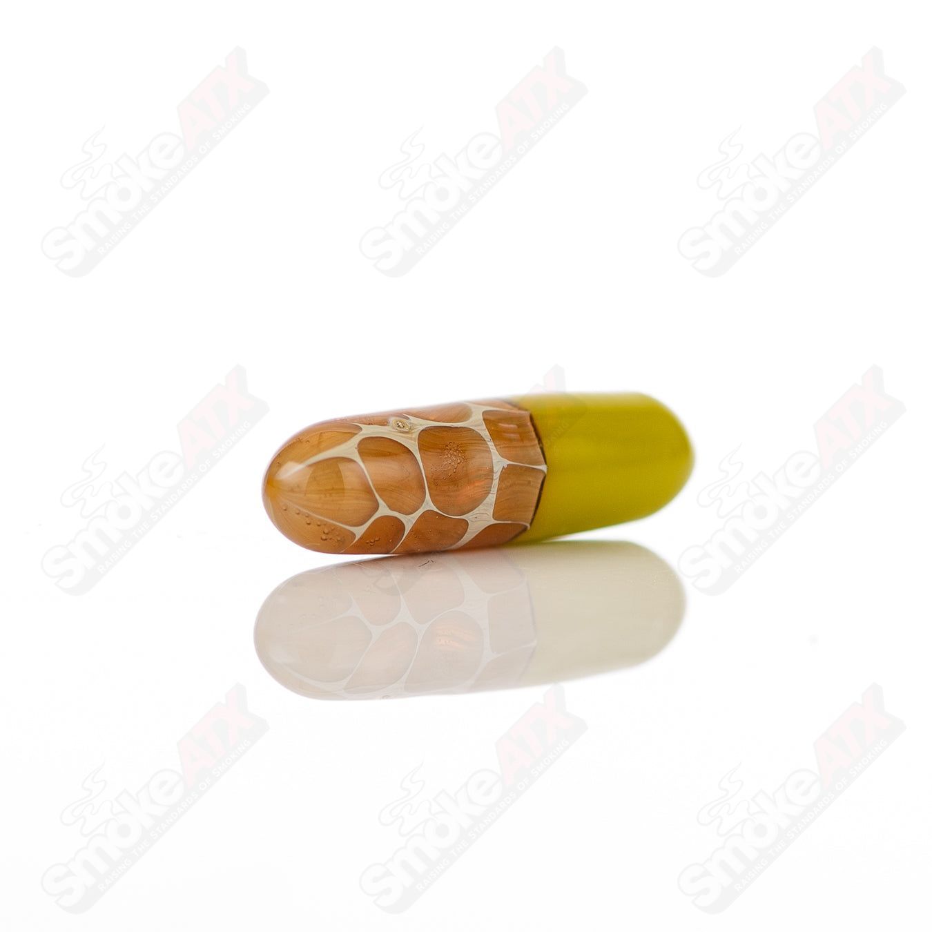 Close-up of a Robertson Glass #2 Terp Pill from 710 Products, showcasing the clear glass with detailed design.