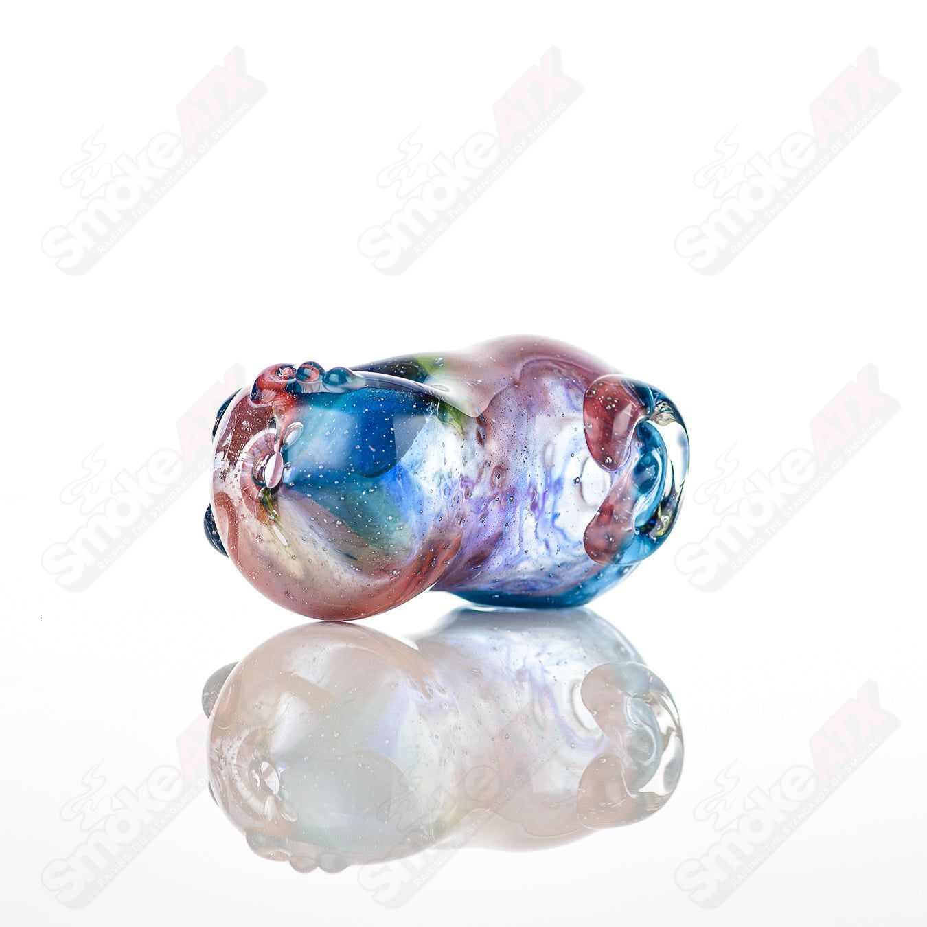 Glass pipe with a bean-shaped spoon design, crafted by Nobody, made of clear glass perfect for casual use.