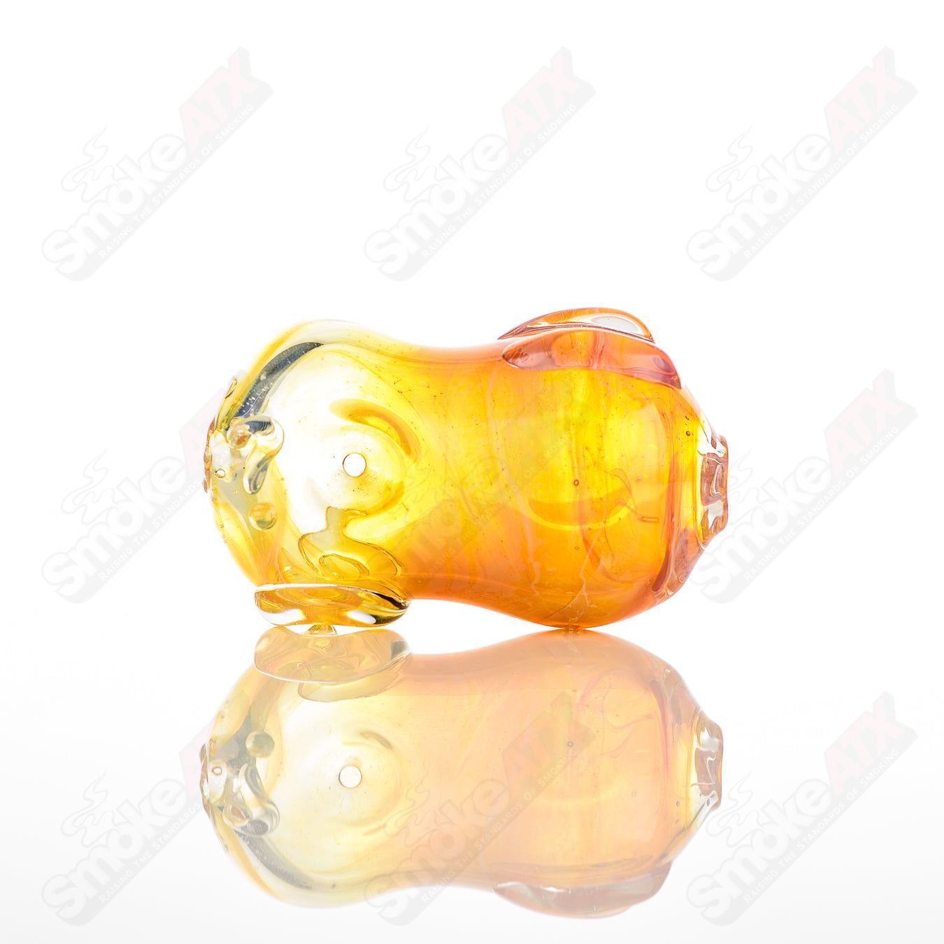 Glass pipe called the #24 Bean Spoon by Nobody, featuring a clear glass design with bean-shaped details for smooth use.