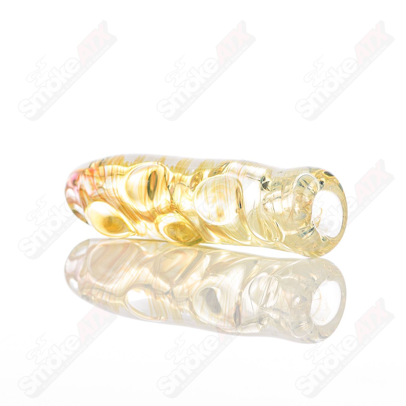 Clear Texas Hot Glass taster chillum with a smooth, rounded shape and detailed design, perfect for enjoying flavorful experiences.
