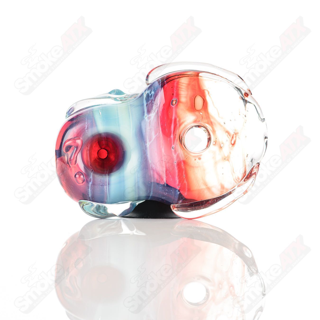 Glass pipe featuring a colorful donut chillum design by Nobody, made of clear glass for smoking enthusiasts.