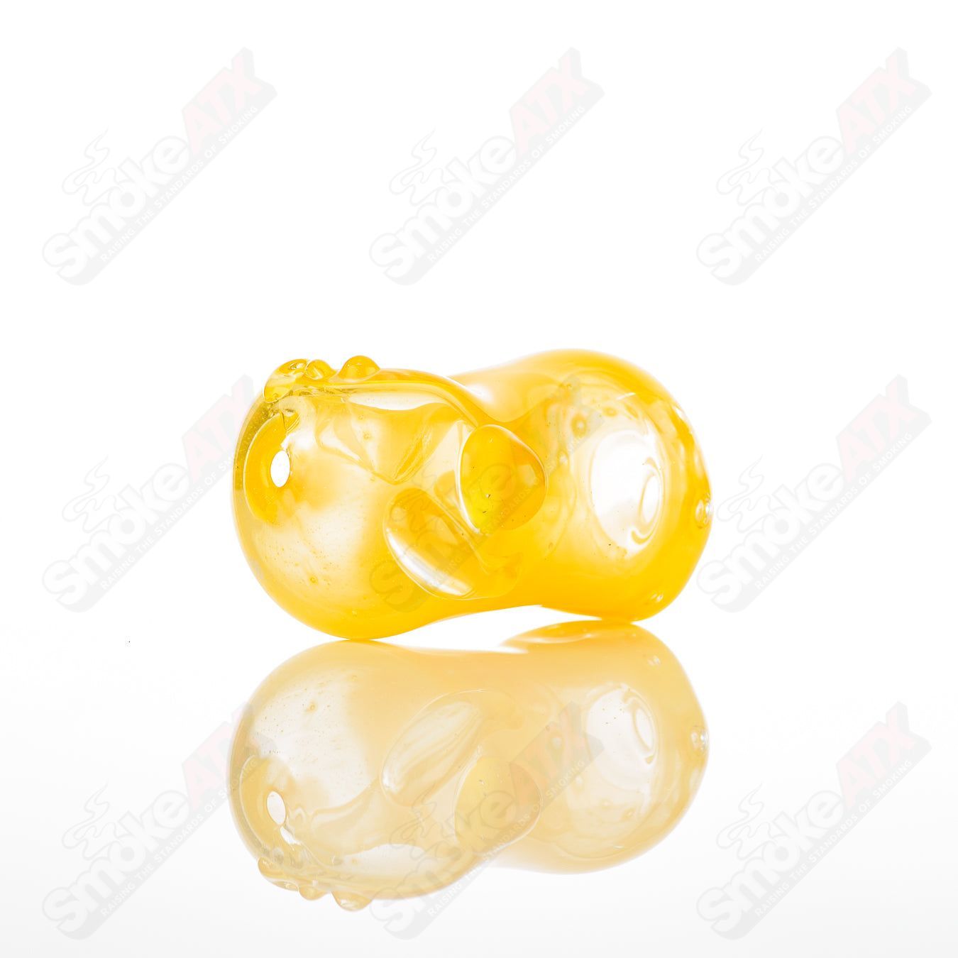 Glass pipe called the #28 Bean Spoon by Nobody, featuring a clear glass design with a bean-shaped bowl and smooth mouthpiece.