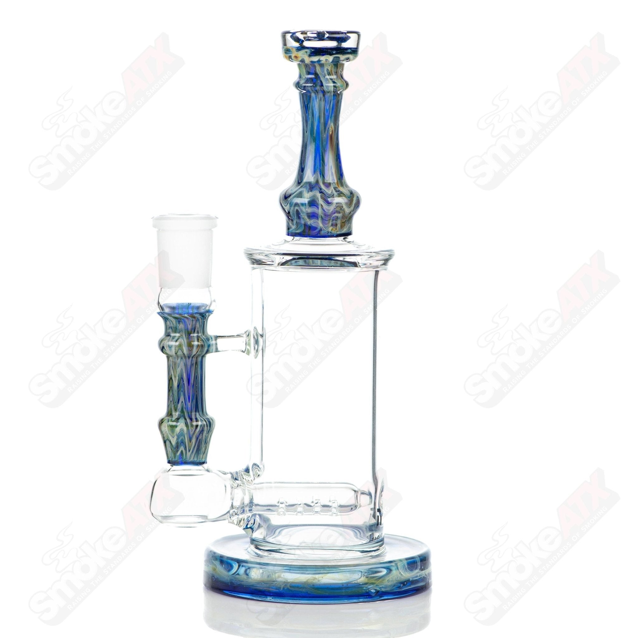 Tagle Glass inline tube bubbler with 18mm and 50mm wrap and rake design, made of clear glass with intricate details.
