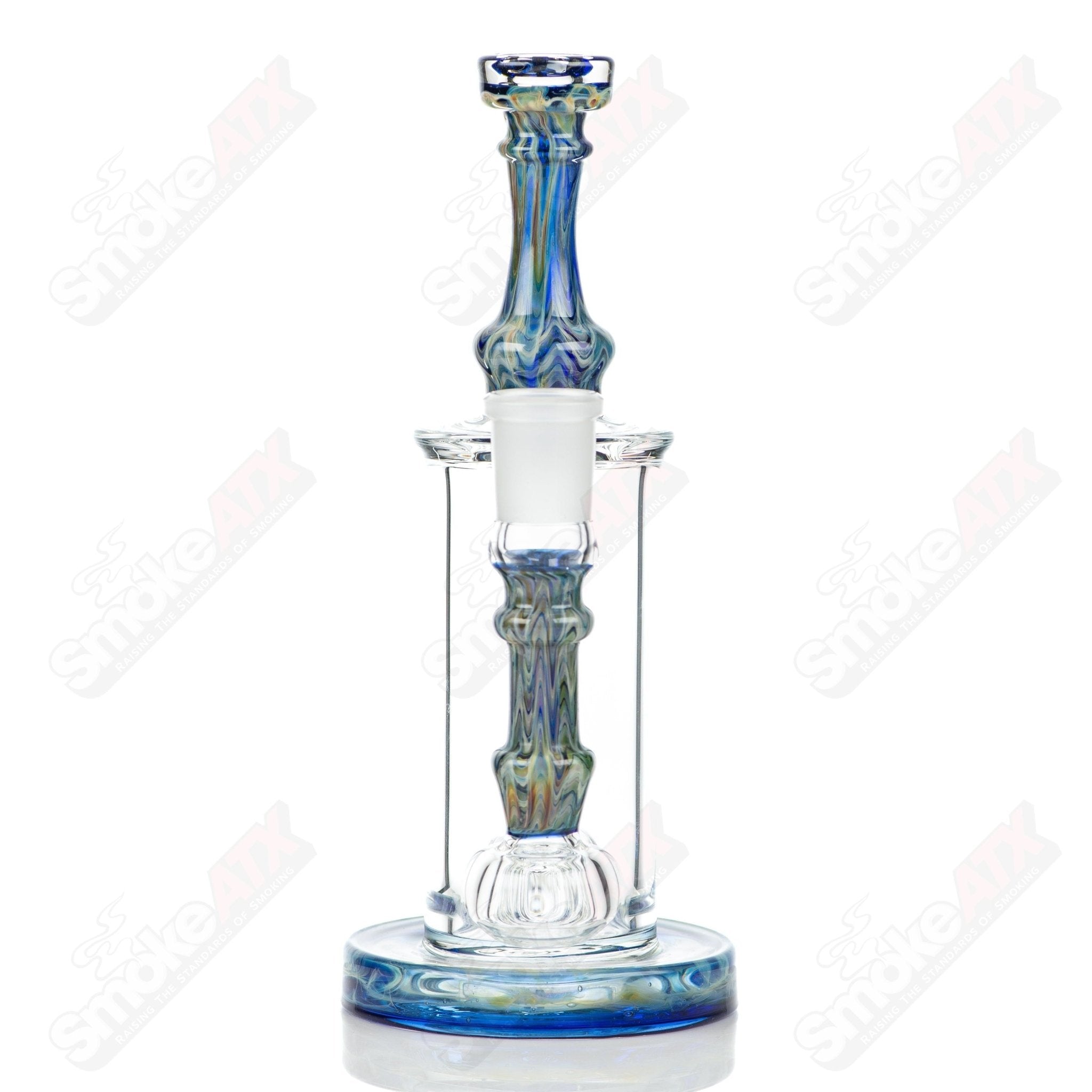 Tagle Glass inline tube bubbler with 18mm and 50mm wrap and rake design, made of clear glass with intricate details.