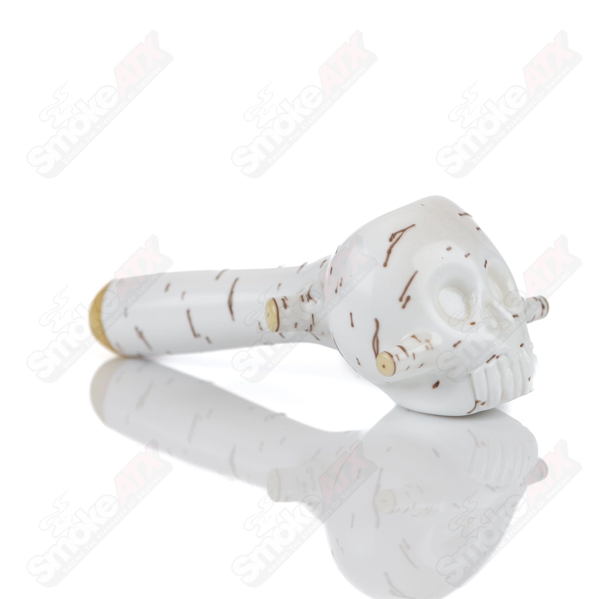 Foster Glass Heady Glass 3-birch skull spoon hand pipe with detailed skull design and clear glass construction.