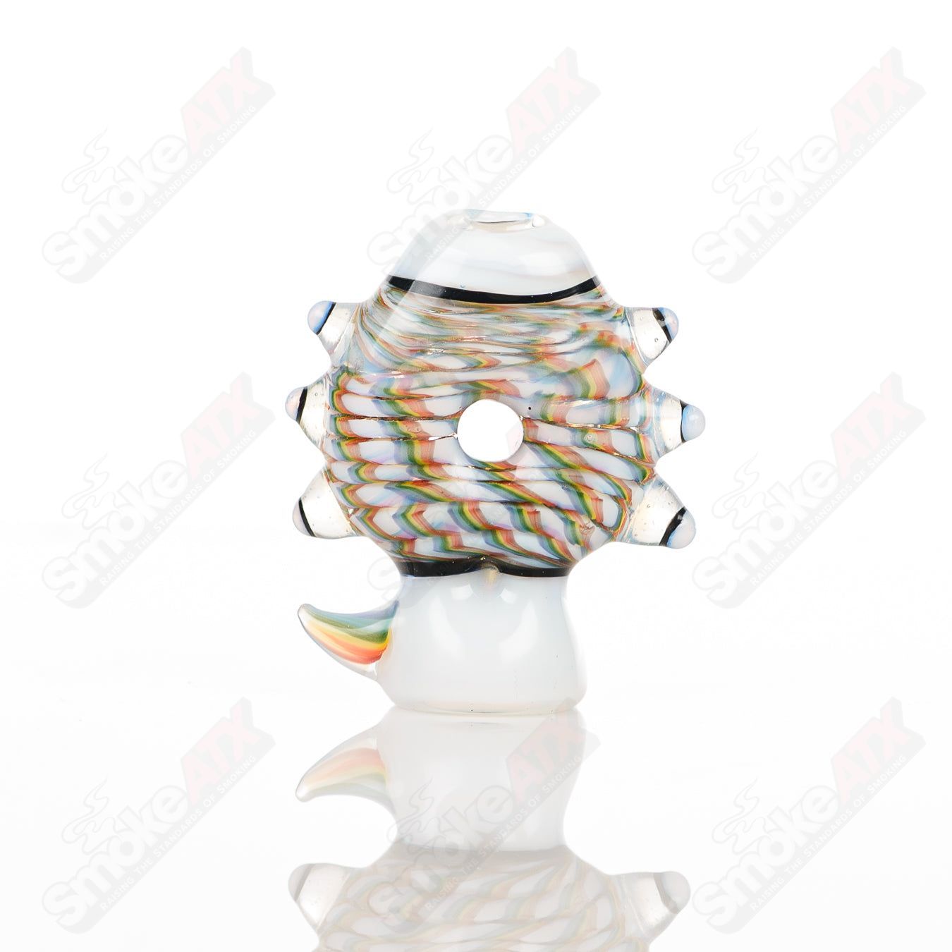 Large glass Donut Chillum by Baby Dabs, featuring a colorful donut design, used for smoking concentrates.