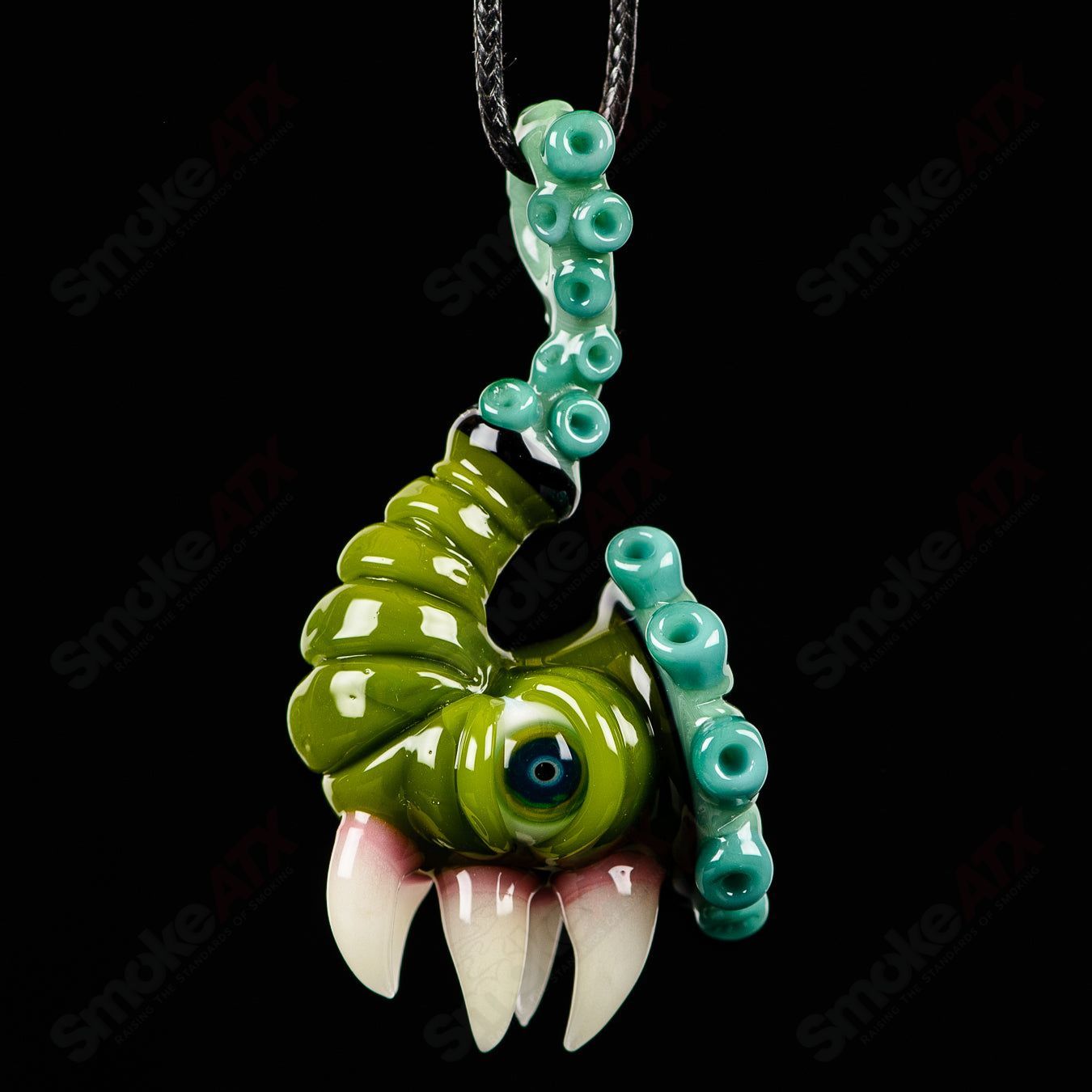JMass Sherlock Pendant made of heady glass, featuring intricate designs in vibrant colors on a detailed pendant.