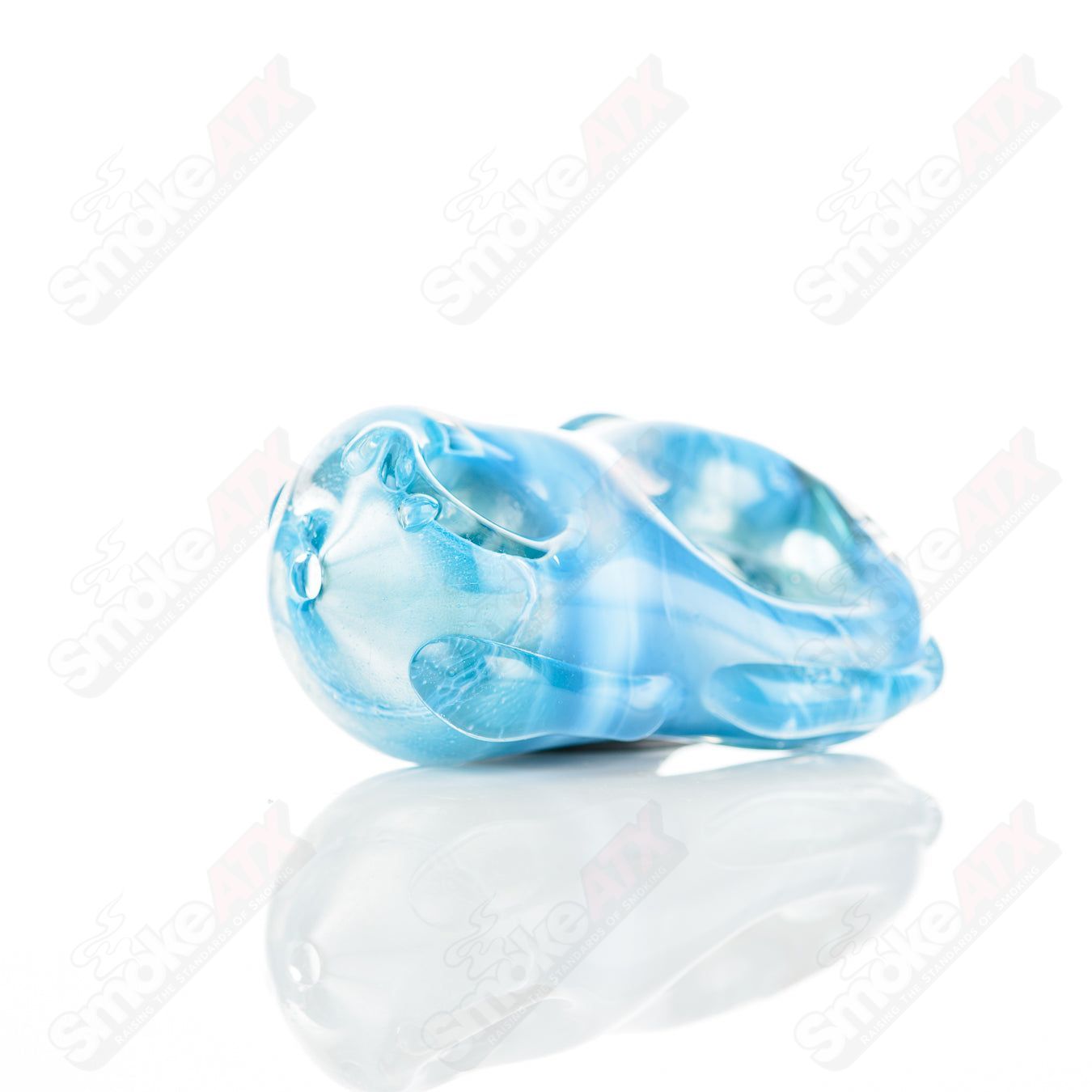 Glass pipe featuring a #6 Donut Chillum design by Nobody, made of clear glass with a smooth bowl and artistic detailing.